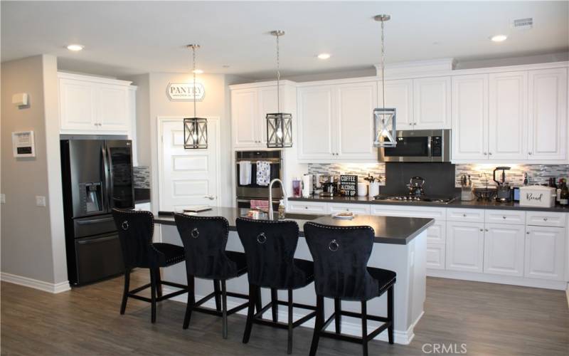 Kitchen with island and walk-in pantry