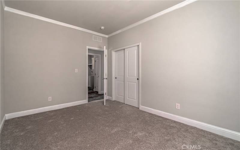 Third bedroom with plush carpet