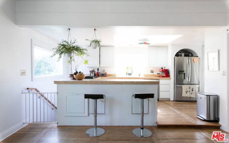 Sit at the Bar Stools in the Kitchen