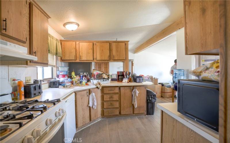 Newer tile floors flow throughout the kitchen, laundry and dining area.
