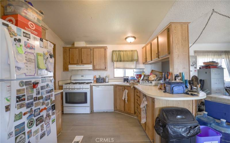 The well appointed kitchen has abundant cabinetry and ample counterspace.
