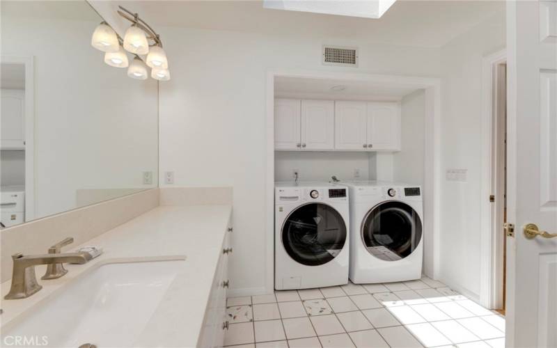 convenient washer and dryer in master suite