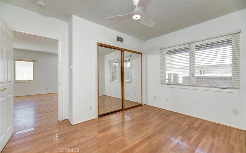 first level bedroom and mirrored closet