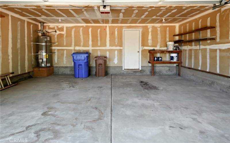 2 Car garage with door leading to sub level storage