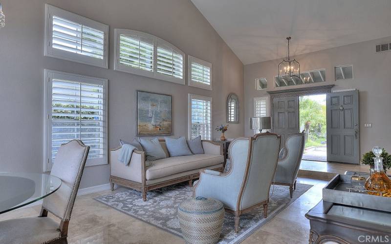 This home is highlighted by Travertine floors, Plantation Shutters and upgrade throughout