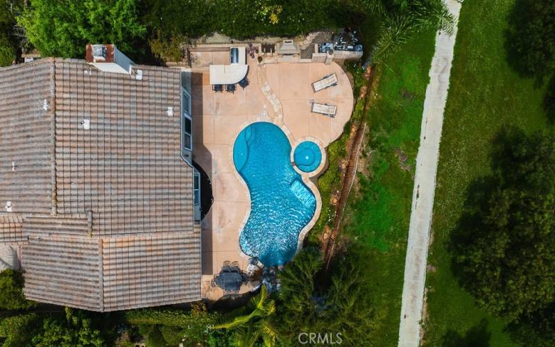 Aerial view of the home and pool