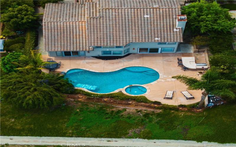 Aerial view of home and lot with pool & spa