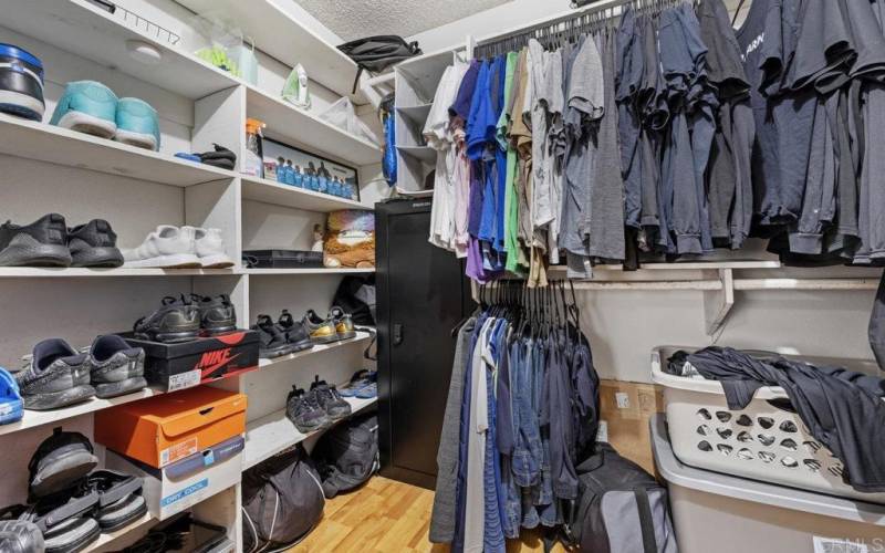 Principle bedroom walk-in-closet.