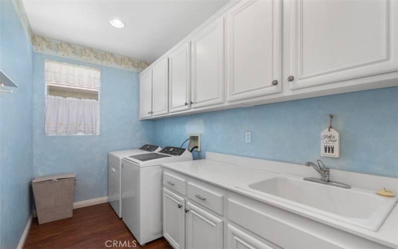 laundry room with lots of storage