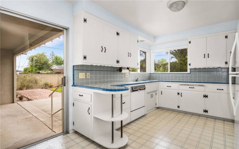 Kitchen with sliding door to backyard.