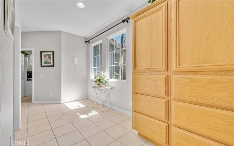 Spacious hallway with storage cabinets leading to additional 3 bedrooms.