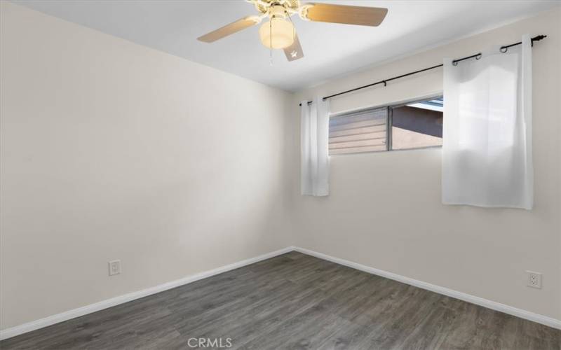 Back bedroom with ceiling fan