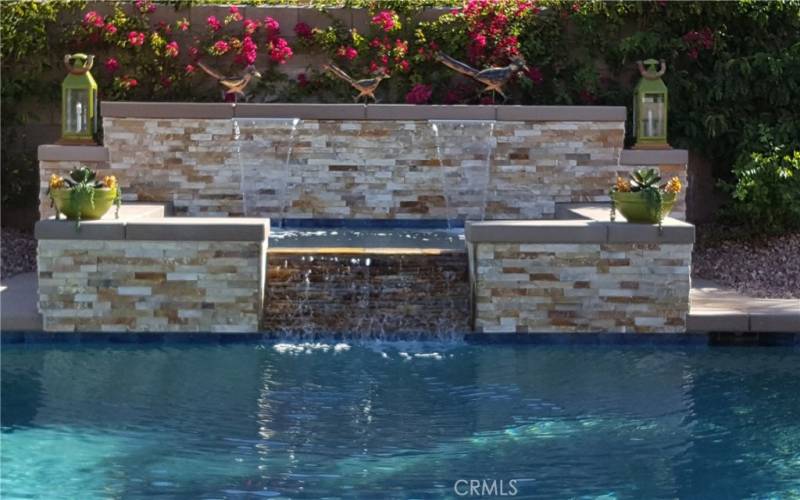 Spa with waterfall into the pool