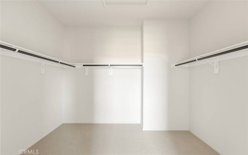 Extra large walk-in closet in primary bedroom.