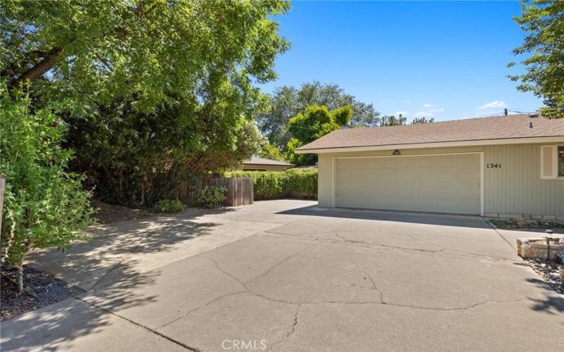 Room to park an RV or Boat behind a fence and hedge on side of house