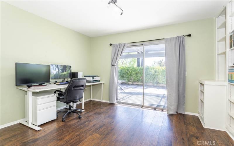 Large room #2 downstairs with double door entry and sliding glass door that leads to backyard.