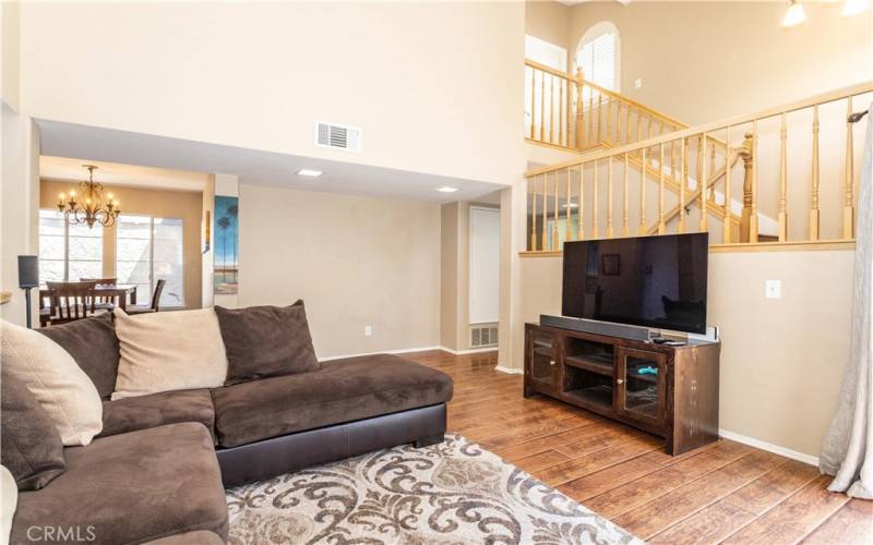 Livingroom view of staircase to primary bedrom.