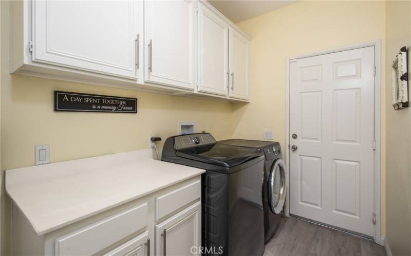 INDOOR LAUNDRY ROOM WITH DIRECT ACCESS TO GARAGE