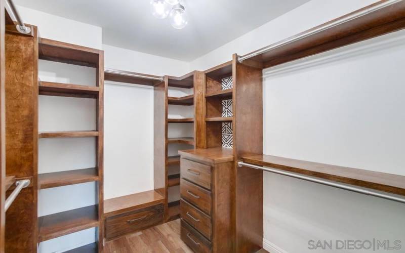 Walk in closet with tons of built in storage