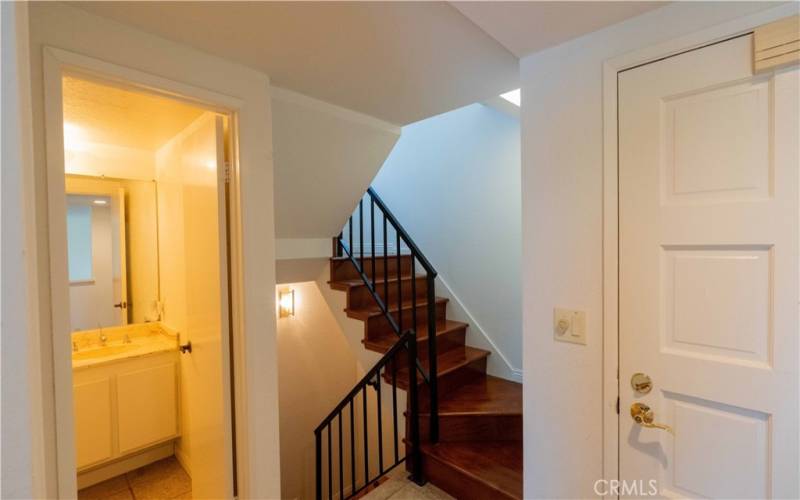 Front Door, entry level bath, stairs to upper and lower level