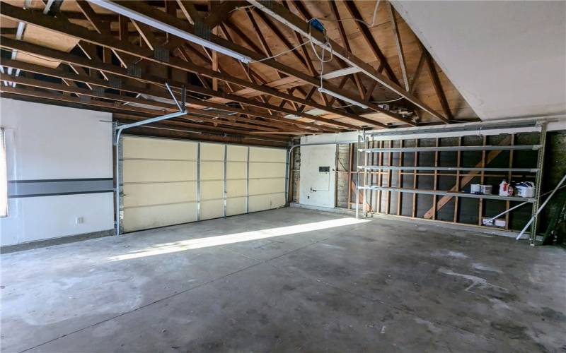 Huge garage with space to park three cars.