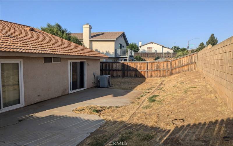 Generous size fully-fenced backyard.