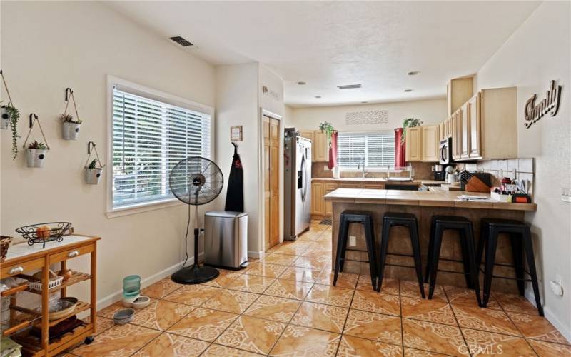 The kitchen also has a dining space & a breakfast bar