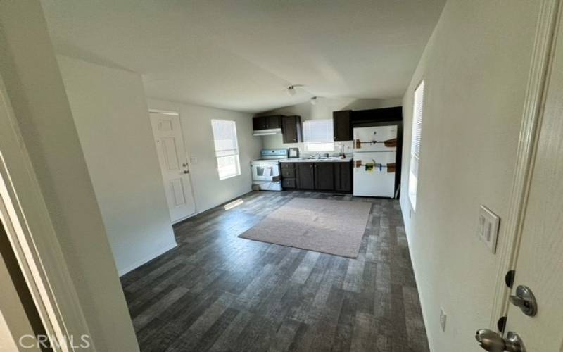 View of kitchen, dining and living area.