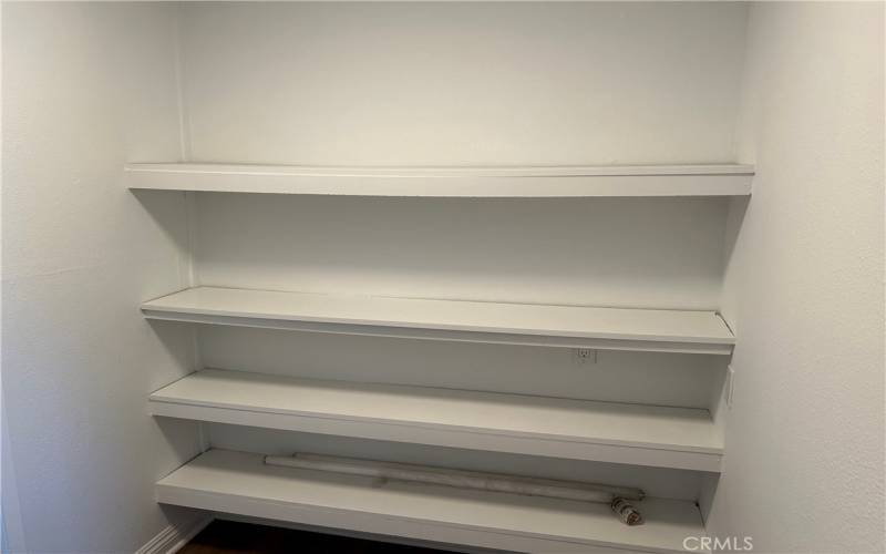 Storage shelving between living and Office -4th bedroom