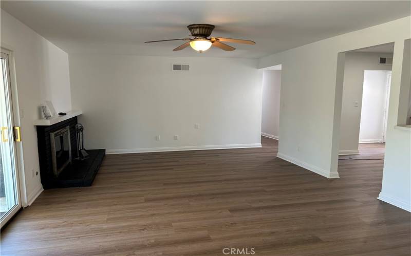 Living room with Fireplace and Sliding Door to Large Yard and Covered Patio