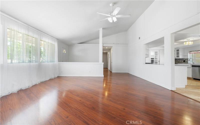 Entry is just beyond the pony/half wall and down the hall there are 2 closets on the right with a shared hallway bath with 2 bedrooms on the left