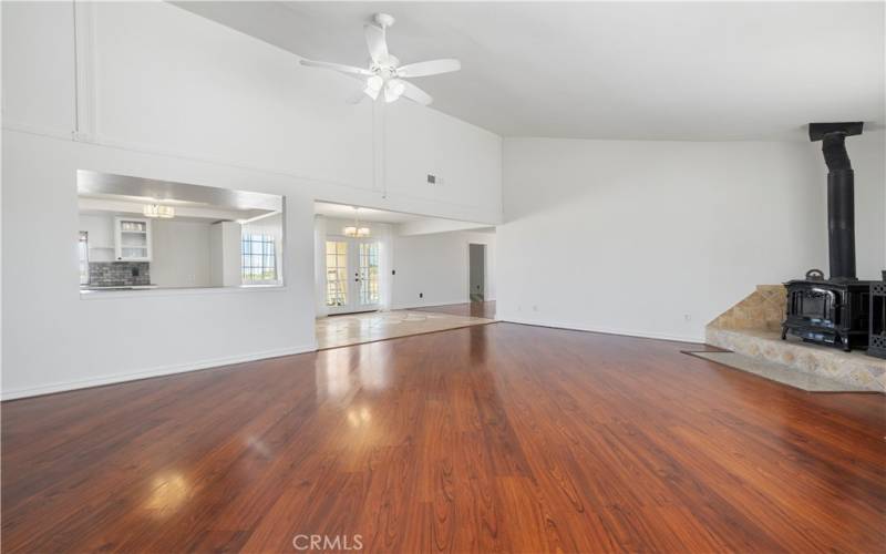 As you enter the home, the foyer is open and you can see into the living room, dining room and kitchen