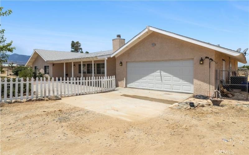 2 Car garage with driveway faces front but garage has been modified to accommodate laundry room