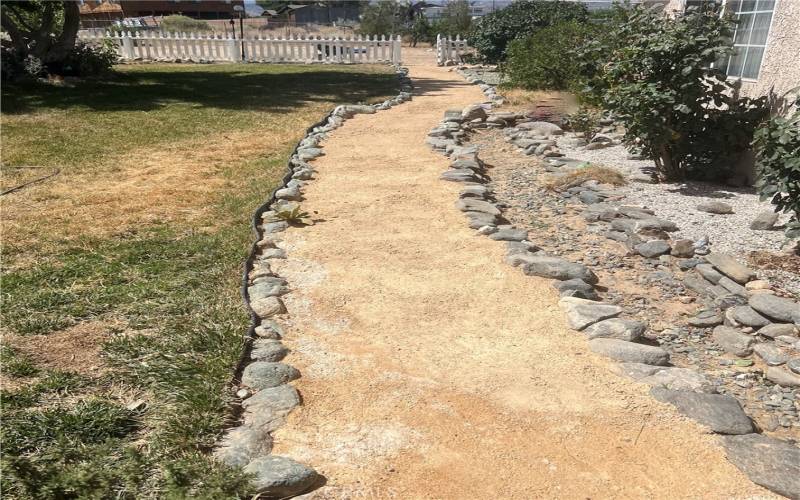 Walkway from front porch to left side of home