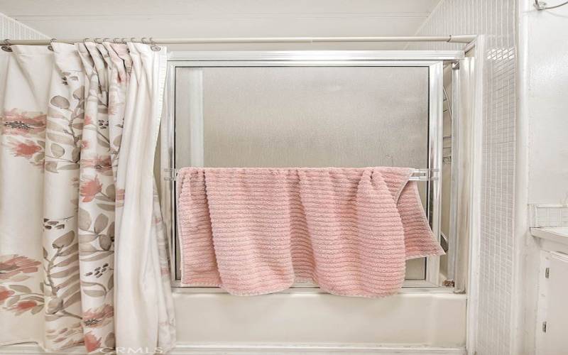 Bathroom with tub and shower combo