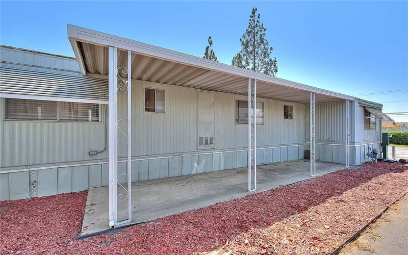 Side of mobile home to use as a sitting area or park motorcycle