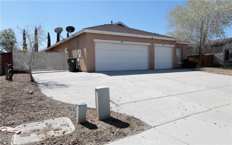 Front of home featuring the RV parking behind the gate