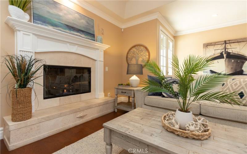 Gas fireplace and focal lighting over the mantel.