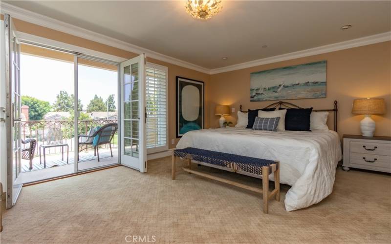 French doors to the primary balcony.