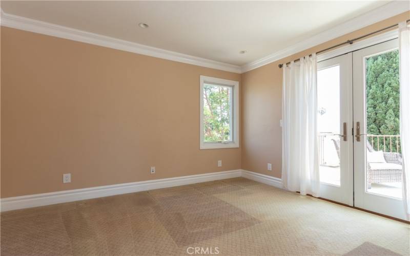 Secondary bedroom upstairs with deck access.