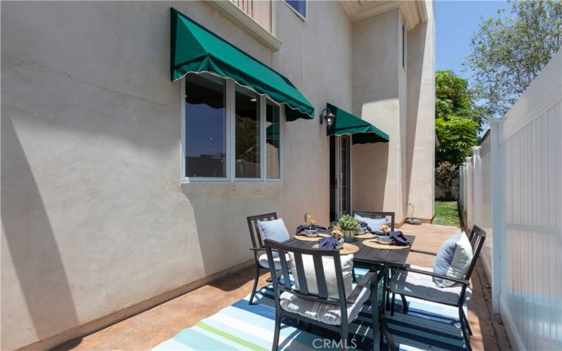 Side yard patio perfect for outdoor dining.