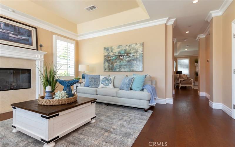 Hallway near living room leads to family room and more!