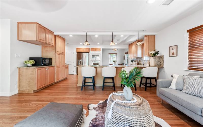 Family room looking to kitchen and dining area