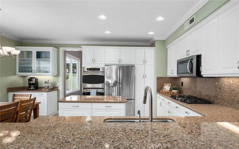 Quartz Countertops and Stainless Steel Appliances in Kitchen