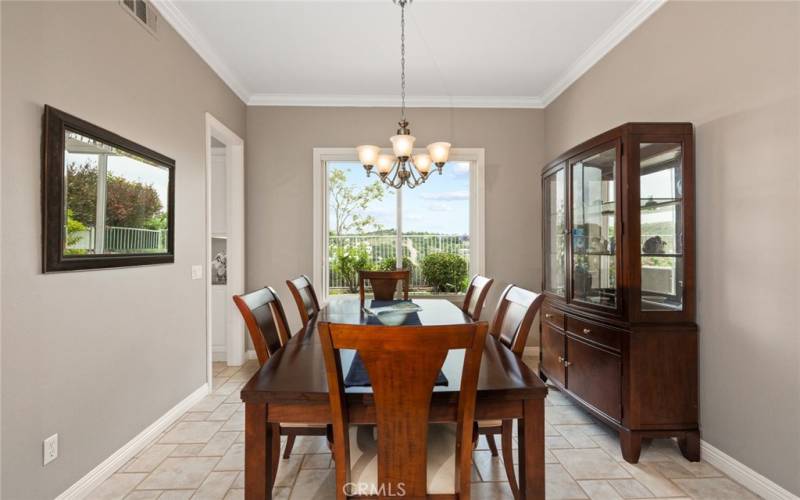 Dining Room with Large Window overlooking backyard