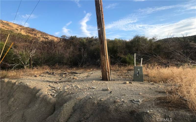 Electricity box and pole on site