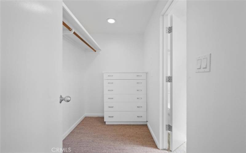 Large walk in closet with built in dresser!