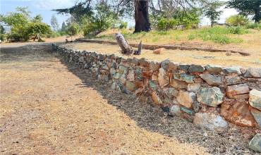 Rock wall next to south driveway