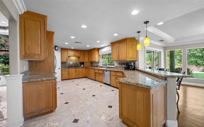 Huge upgraded kitchen is a chef's dream, complete with stainless steel appliances, a walk-in pantry, ample cabinets, and counter space