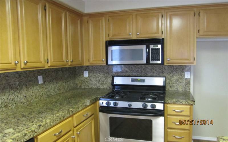 Maple Cabinets, Granite Tile Counters - Stainless Steel Appliances
